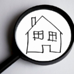 Une loupe avec une maison dessinée